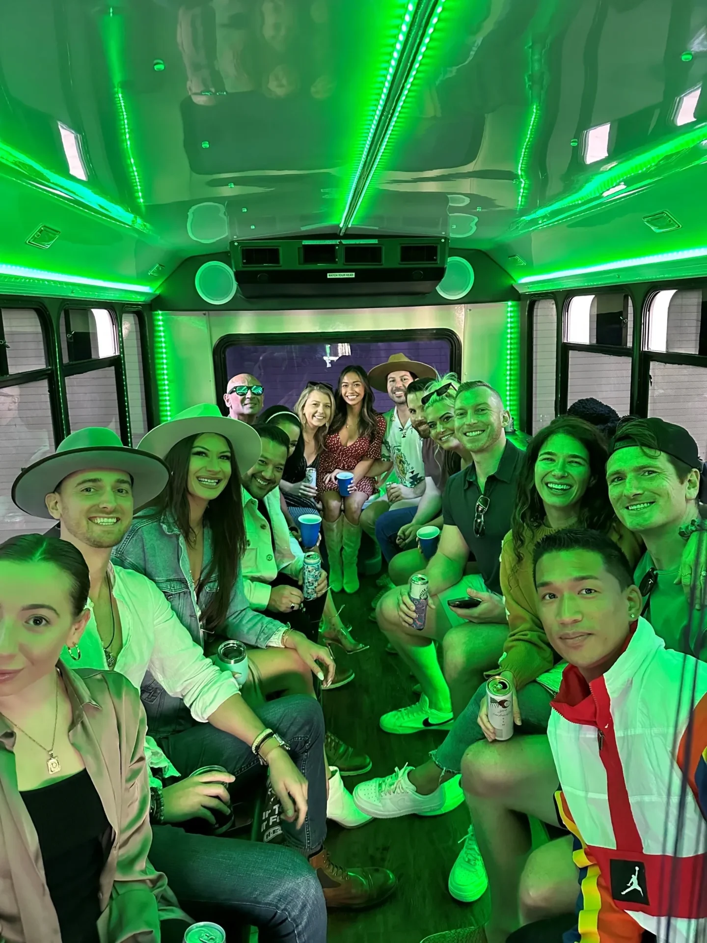 A group of people in the back of a bus.